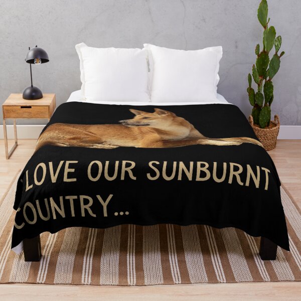 Item preview, I Iove our sunburnt country. Photograph of a dingo, lazing in the sun, and light colour text. designed and sold by JellyBeenzz.