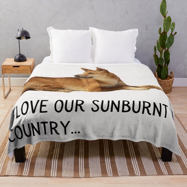 Item preview, I Iove our sunburnt country. Photograph of a dingo, lazing in the sun, and black text. designed and sold by JellyBeenzz.