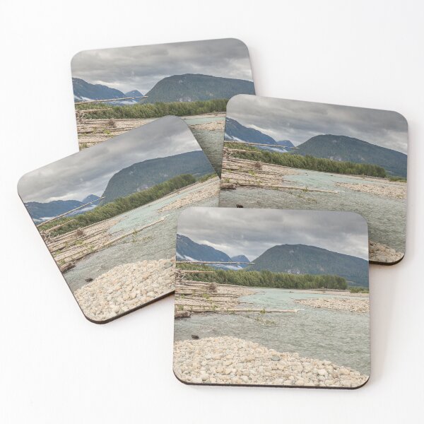 Item preview, Log jam at the Shames and Skeena River confluence, on a cloudy day, with forest and mountains in the background. designed and sold by SnapTPhotograph.