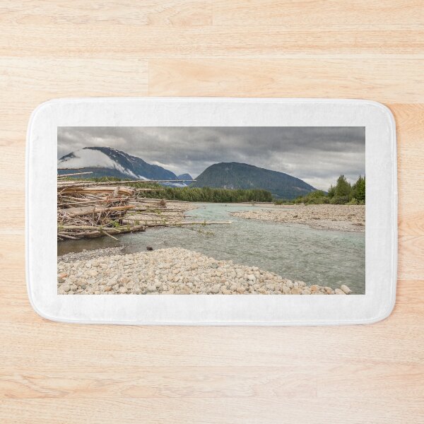Item preview, Log jam at the Shames and Skeena River confluence, on a cloudy day, with forest and mountains in the background. designed and sold by SnapTPhotograph.