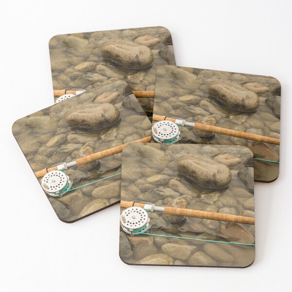 Item preview, Spey fly rod and reel resting on wet rocks beside a river. designed and sold by SnapTPhotograph.
