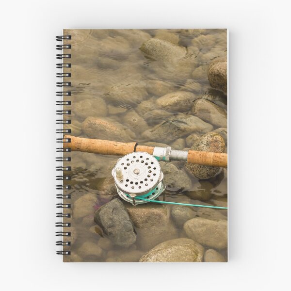 Item preview, Spey fly rod and reel resting on wet rocks beside a river. designed and sold by SnapTPhotograph.