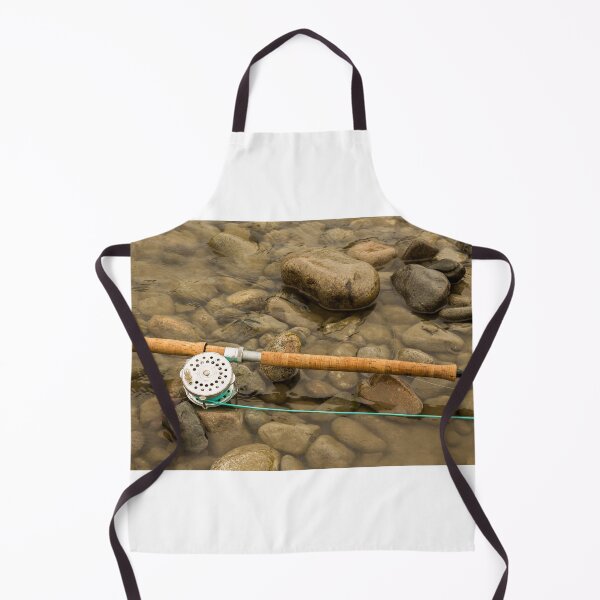 Item preview, Spey fly rod and reel resting on wet rocks beside a river. designed and sold by SnapTPhotograph.