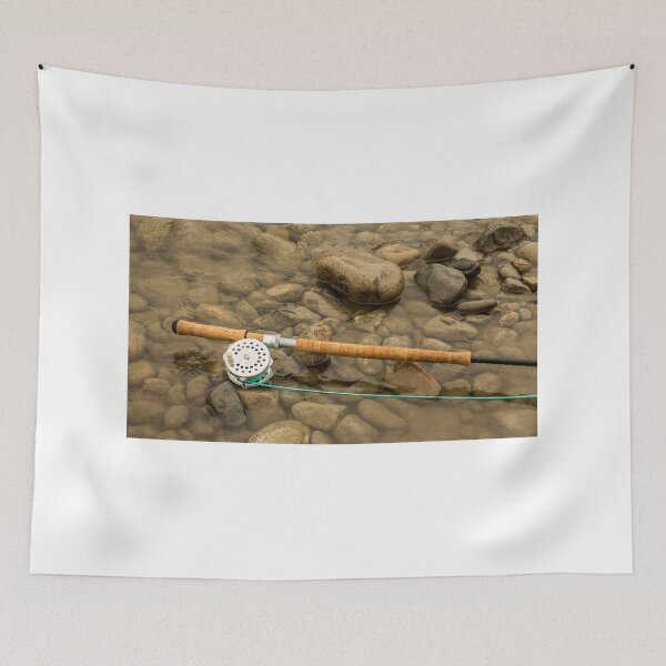 Item preview, Spey fly rod and reel resting on wet rocks beside a river. designed and sold by SnapTPhotograph.