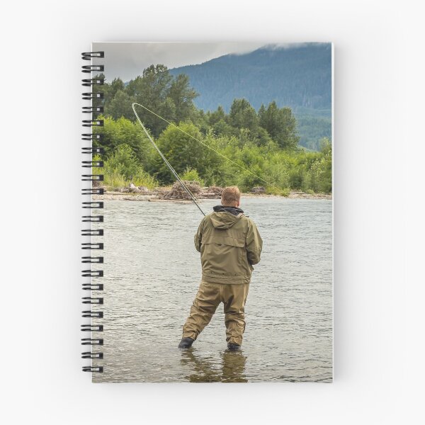 Item preview, Fisherman battling a fish with a bent rod, while wading. designed and sold by SnapTPhotograph.