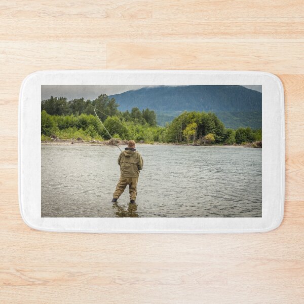 Item preview, Fisherman battling a fish with a bent rod, while wading. designed and sold by SnapTPhotograph.