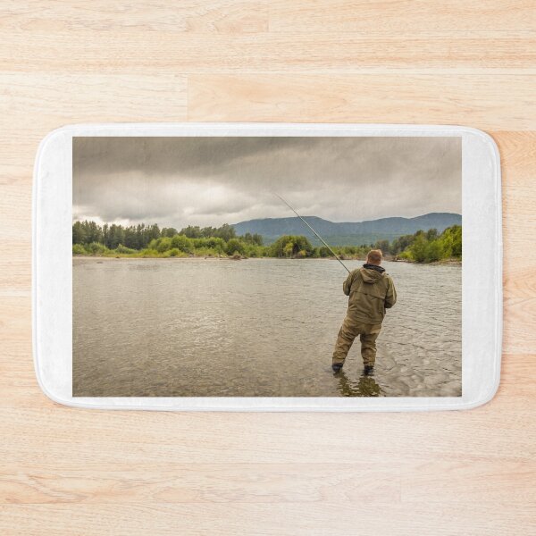 Item preview, Fisherman battling a fish with a bent rod, while wading. designed and sold by SnapTPhotograph.
