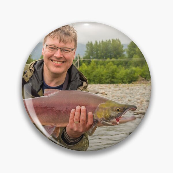 Item preview, A happy fisherman proudly holding up a sockeye salmon designed and sold by SnapTPhotograph.