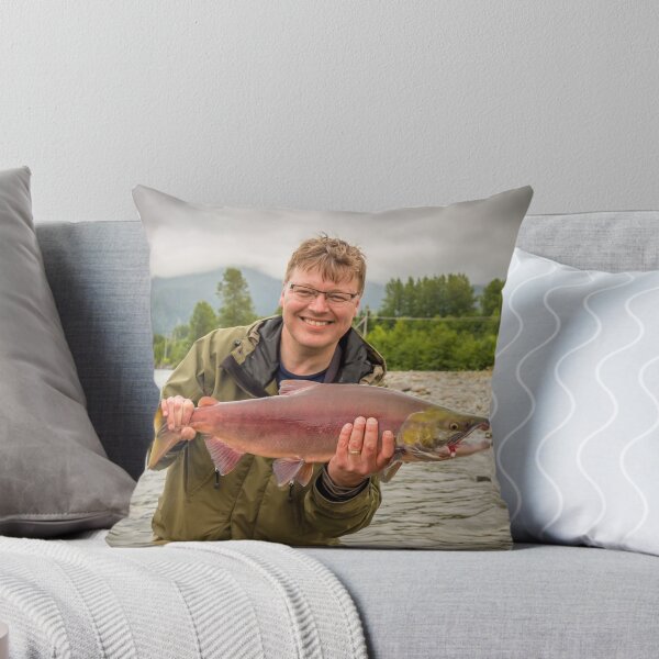 Item preview, A happy fisherman proudly holding up a sockeye salmon designed and sold by SnapTPhotograph.