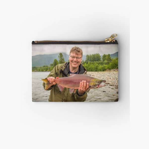 Item preview, A happy fisherman proudly holding up a sockeye salmon designed and sold by SnapTPhotograph.