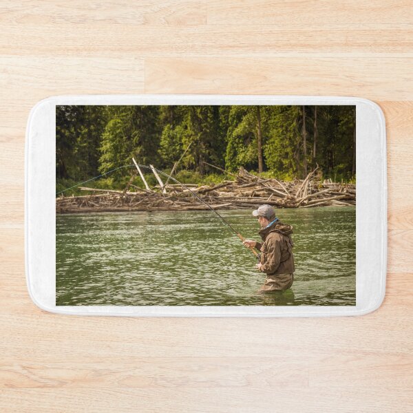 Item preview, A man hooked into a fish while fly fishing on a deep green river. designed and sold by SnapTPhotograph.