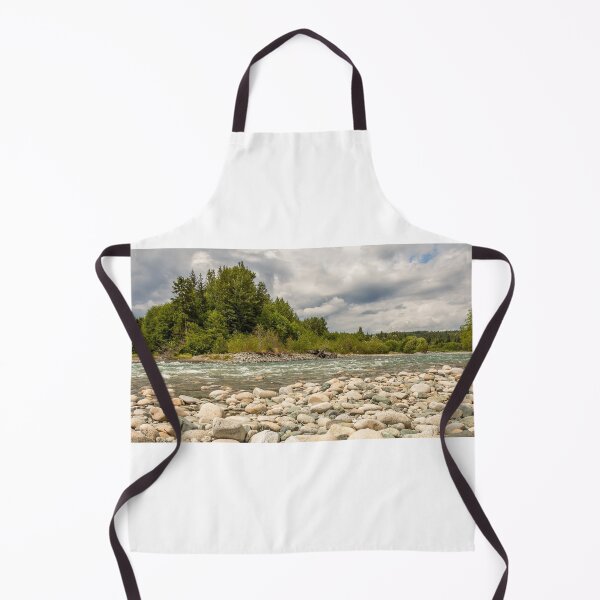 Item preview, A boulder strewn, fast flowing river, beside a forest, on a cloudy day. designed and sold by SnapTPhotograph.