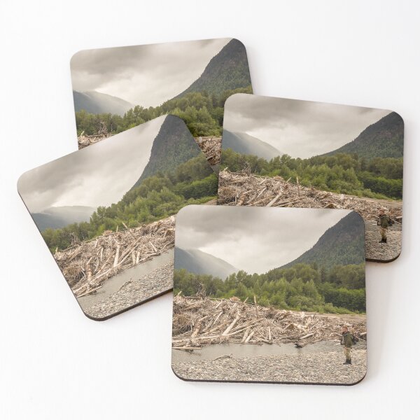 Item preview, A man standing beside a very big log jam on a river in British Columbia, Canada designed and sold by SnapTPhotograph.