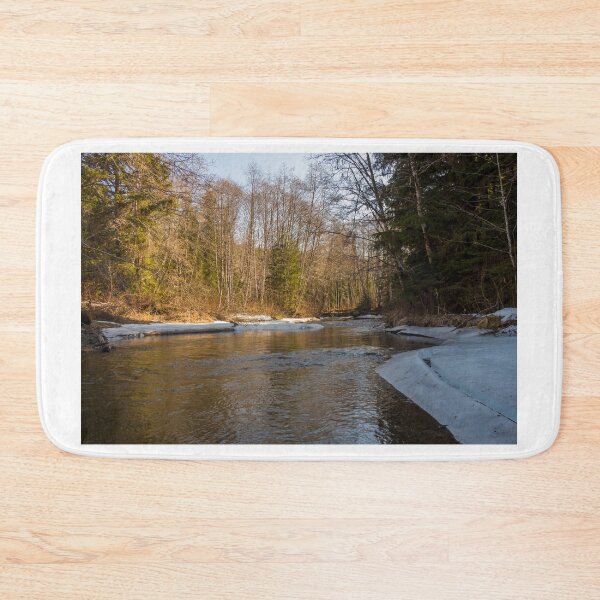 Item preview, A snow covered stream in the spring morning sun designed and sold by SnapTPhotograph.