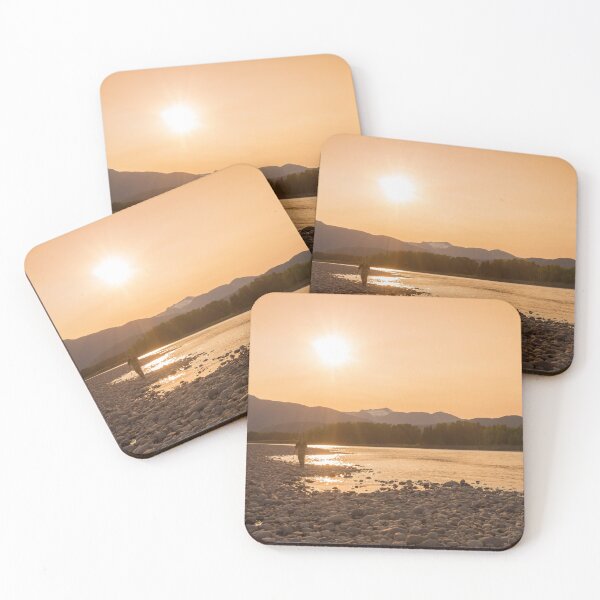 Item preview, A fisherman walking along a gravel bar beside the Skeena River at sunset designed and sold by SnapTPhotograph.