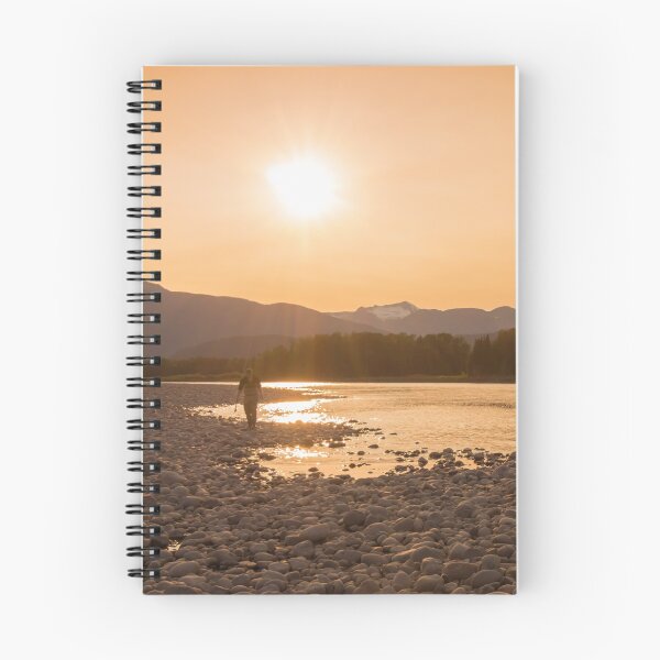 Item preview, A fisherman walking along a gravel bar beside the Skeena River at sunset designed and sold by SnapTPhotograph.