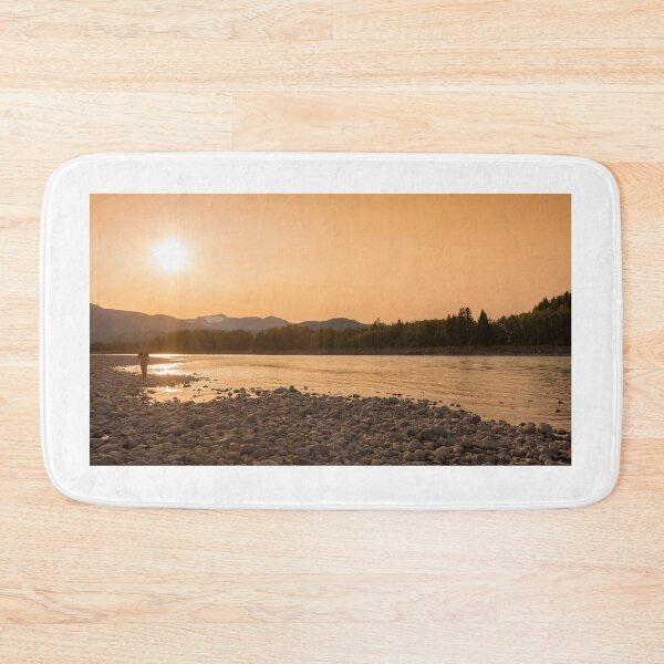 Item preview, A fisherman walking along a gravel bar beside the Skeena River at sunset designed and sold by SnapTPhotograph.