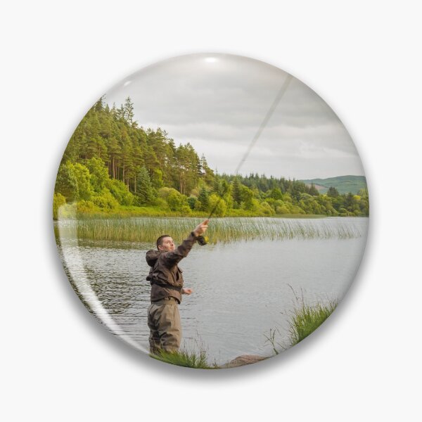 Item preview, An action shot of a fly fisherman casting a pike fly on Loch Stroan, Scotland designed and sold by SnapTPhotograph.