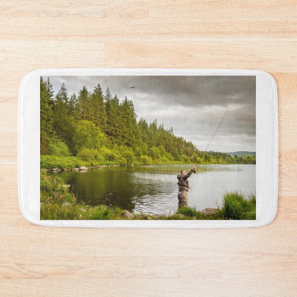 Item preview, An action shot of a fly fisherman casting a pike fly on Loch Stroan, Scotland designed and sold by SnapTPhotograph.