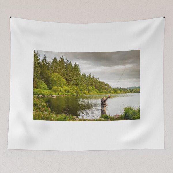 Item preview, An action shot of a fly fisherman casting a pike fly on Loch Stroan, Scotland designed and sold by SnapTPhotograph.