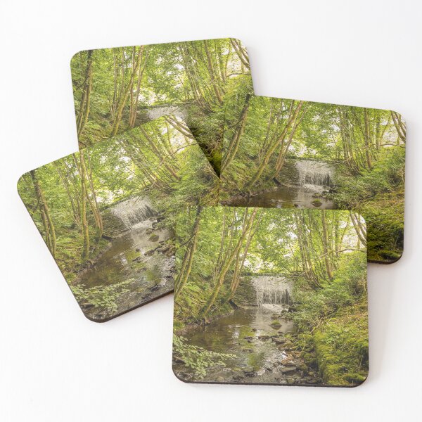 Item preview, Water flowing over an old weir and through a woodland, over stones designed and sold by SnapTPhotograph.