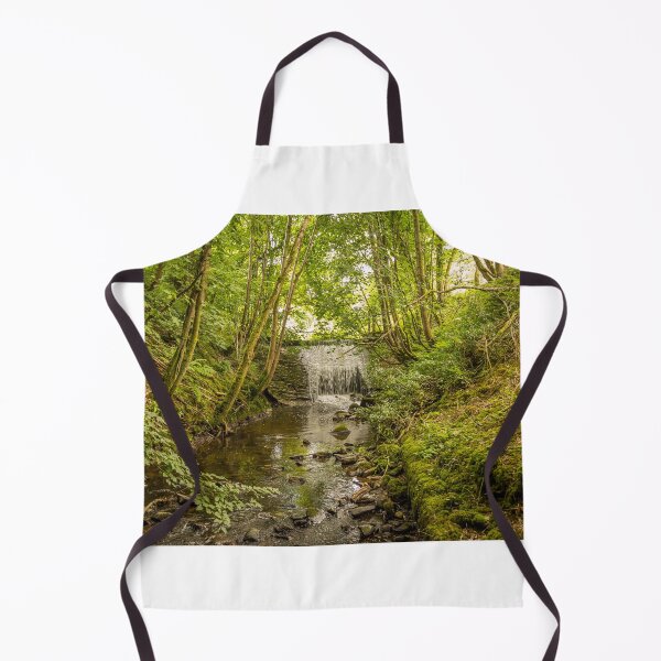 Item preview, Water flowing over an old weir and through a woodland, over stones designed and sold by SnapTPhotograph.