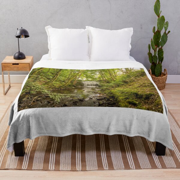 Item preview, Water flowing over an old weir and through a woodland, over stones designed and sold by SnapTPhotograph.