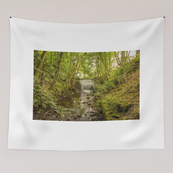 Item preview, Water flowing over an old weir and through a woodland, over stones designed and sold by SnapTPhotograph.