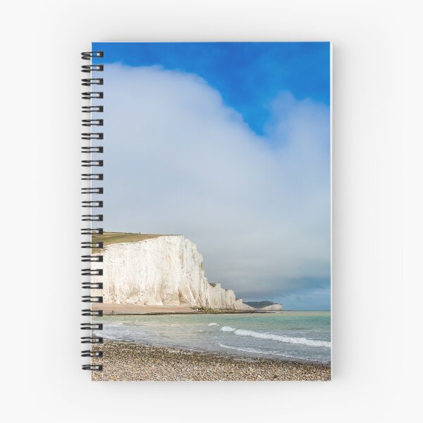 Item preview, Dramatic white cliffs, blue sky and shingle beach at Cuckmere Haven designed and sold by SnapTPhotograph.