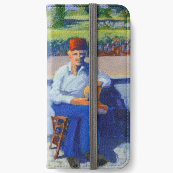 Man sitting by a wall iPhone Wallet