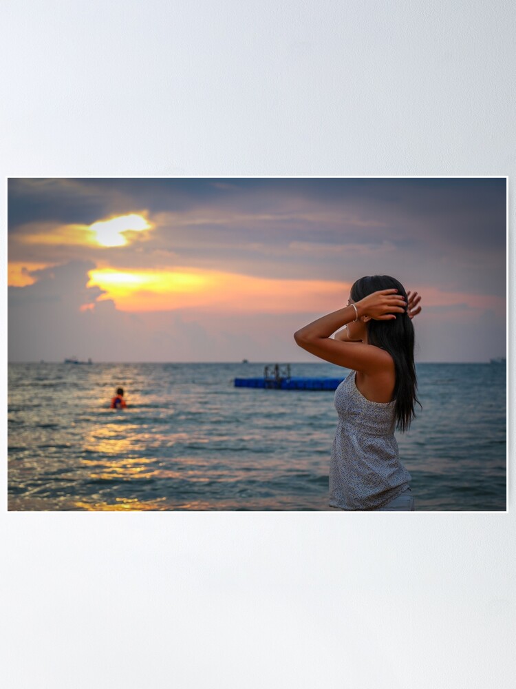 An Asian women admiring the sunset on Ba Keo Beach, Phu Quoc