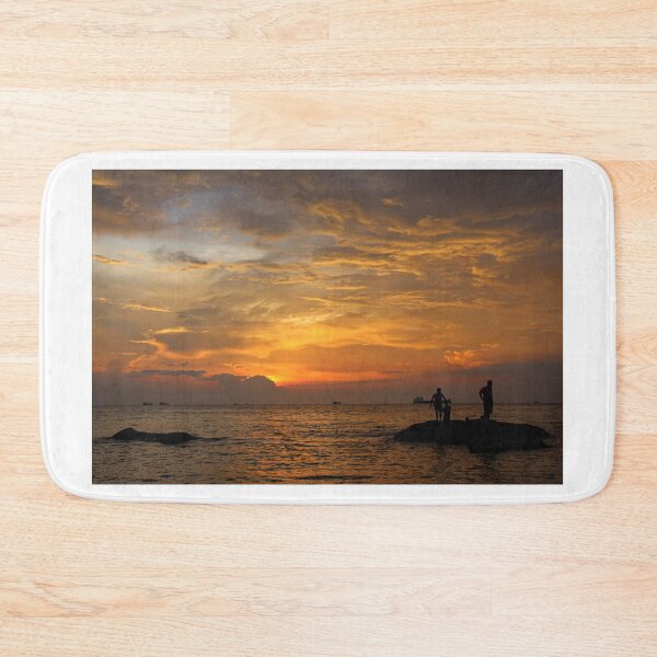 Item preview, A silhouette of fishermen standing on rocks at sunset at Ba Keo Beach designed and sold by SnapTPhotograph.