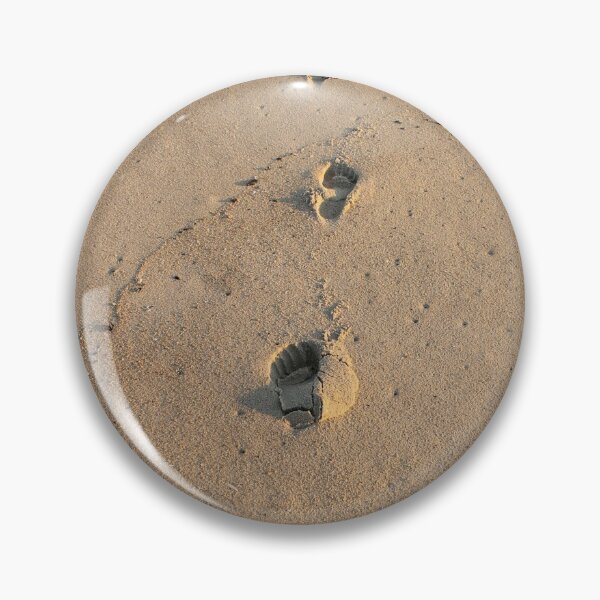 Bare footprints on the coastal sand Pin