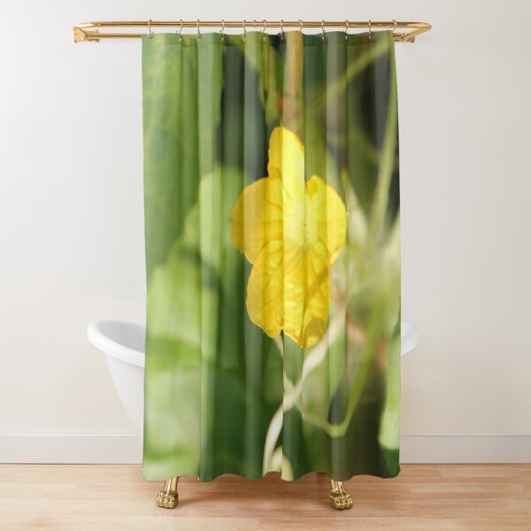 Yellow unnamed flower on a background of green leaves Shower Curtain