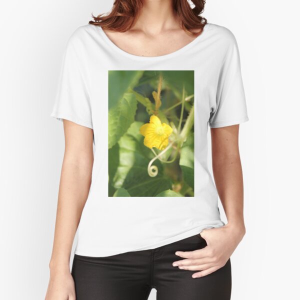 Yellow unnamed flower on a background of green leaves Relaxed Fit T-Shirt
