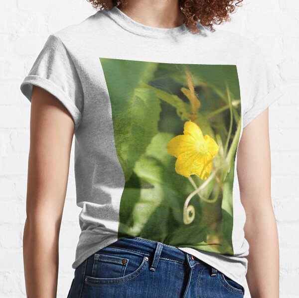 Yellow unnamed flower on a background of green leaves Classic T-Shirt