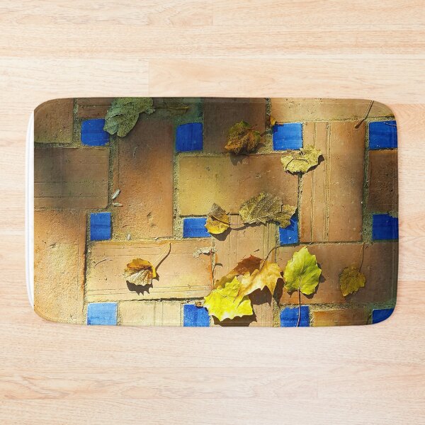 Item preview, Red brick and deep blue tiles with autumn leaves in evening sunlight. designed and sold by janesg.