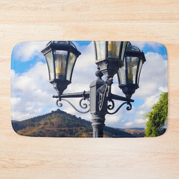 Item preview, Vintage street light in the Andalucian countryside with vivid blue sky and hills. designed and sold by janesg.