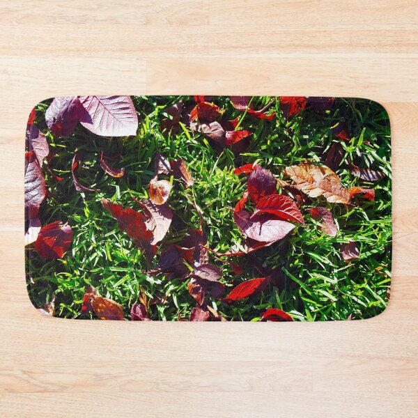 Item preview, Bright red cherry leaves on lush green grass. designed and sold by janesg.