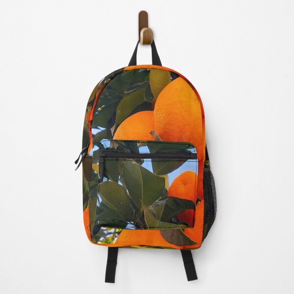 Item preview, Juicy oranges ripe for picking set against a clear blue sky. designed and sold by janesg.