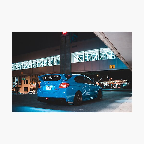 Hyper blue sti sports rally car at night Photographic Print