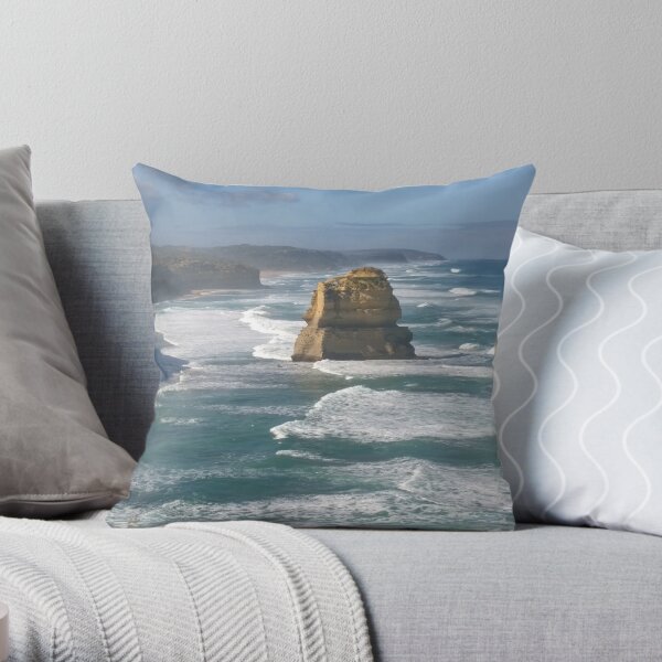 Sunlit Twelve Apostles in wild weather Throw Pillow