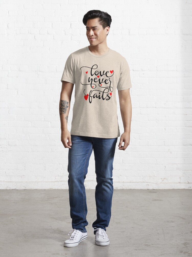 Alternate view of Love Never Fails Essential T-Shirt