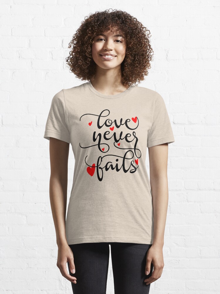 Alternate view of Love Never Fails Essential T-Shirt