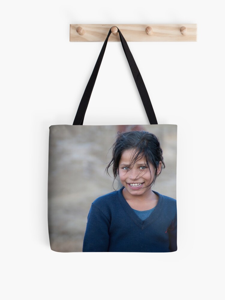 Thumbnail 1 of 2, Tote Bag, Happy Young Girl in Nepal Far West designed and sold by missatgerebut.