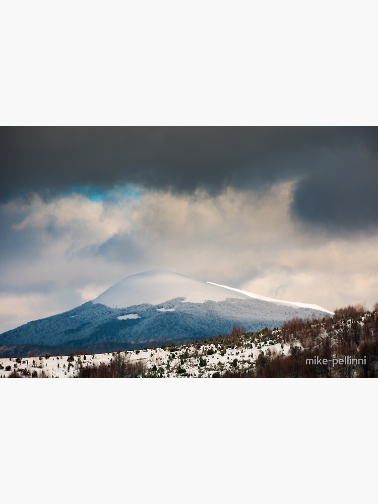 Thumbnail 3 of 3, Sticker, dramatic sky above the distant snowy peak designed and sold by mike-pellinni.