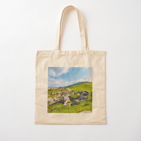 grassy slope with huge rocks Cotton Tote Bag