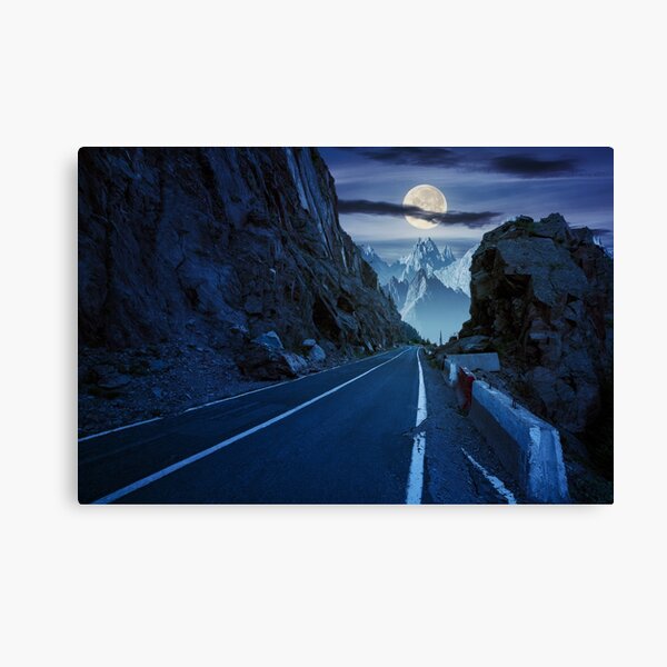 road in to the high mountains at night Canvas Print