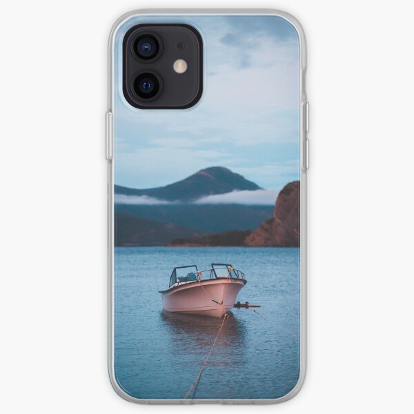 Tranquil boat in the water at sunset iPhone Soft Case