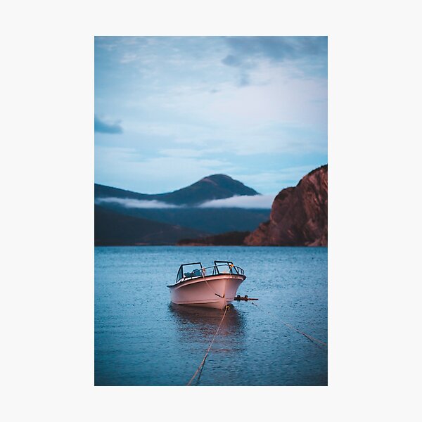Tranquil boat in the water at sunset Photographic Print